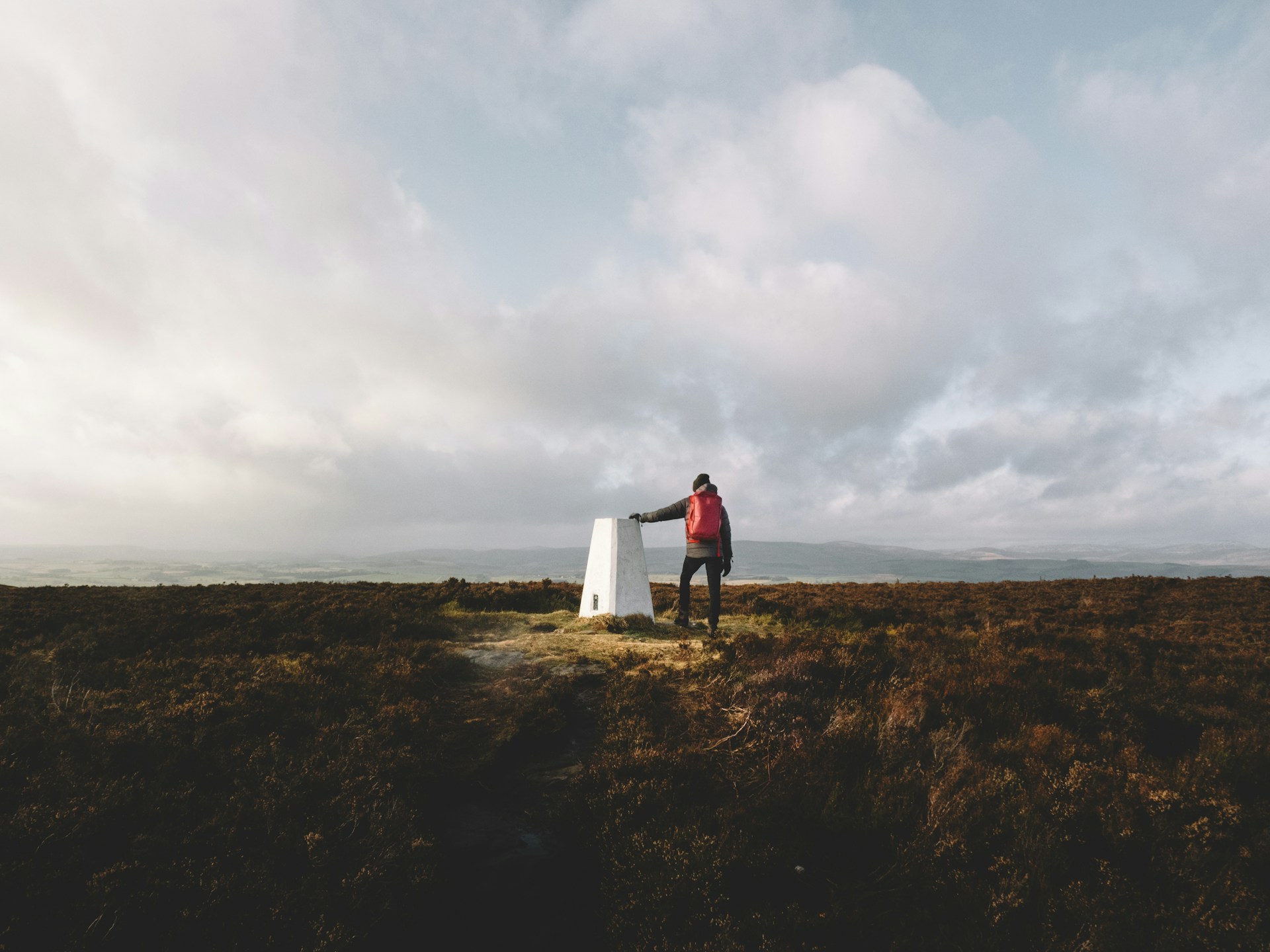A concrete Ordnance Survey trig pillar on a summit